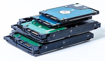 A stack of computer hard drives on a white background